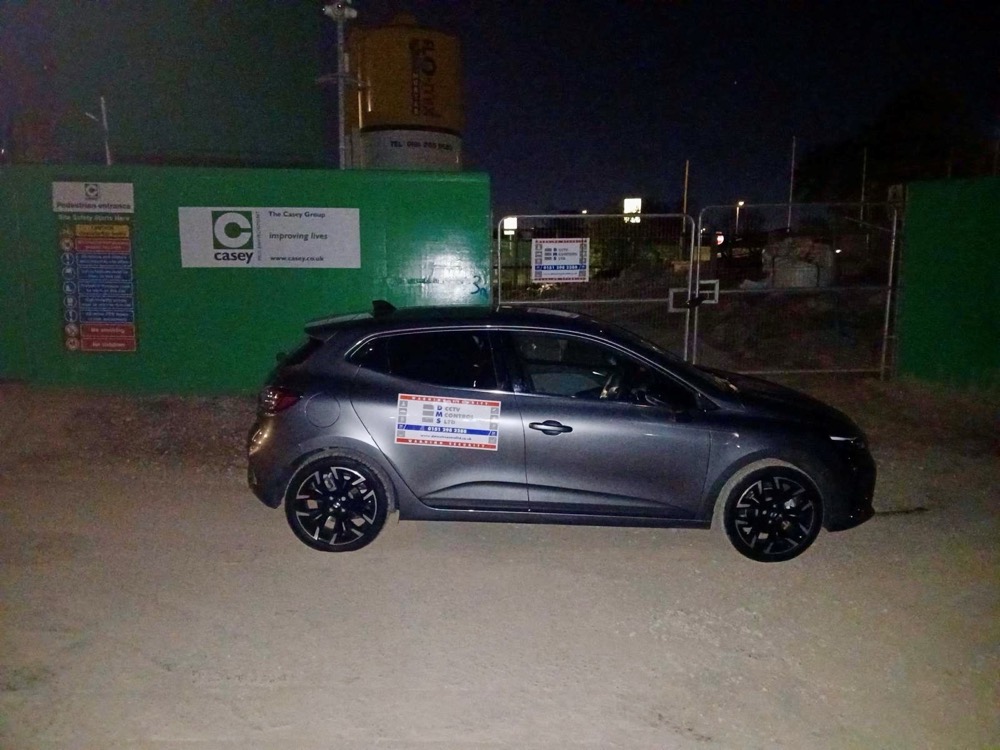 DMS patrol car outside a Casey site at night