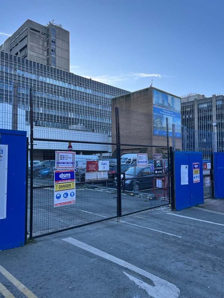 Demolition site gates at the old Royal Liverpool Hospital with DMS and DSM signage