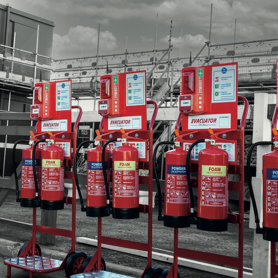 Fire point trolleys carrying Evacuator site alarms and fire extinguishers on a construction site