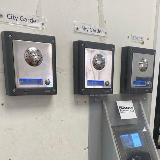 Three door entry intercom panels at a site entrance